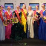 Portrait de Corine Delesie souriante, célébrée pour son rôle essentiel à Miss Tournai, en ce 12 juillet.